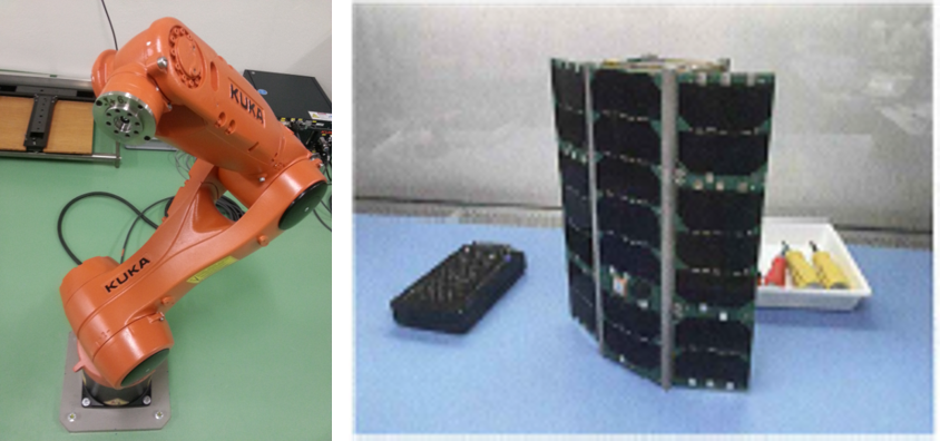 The Kuka industrial robot and the Astrocast cube satellite model equipped with two GNSS antennas that was launched on December 3, 2018